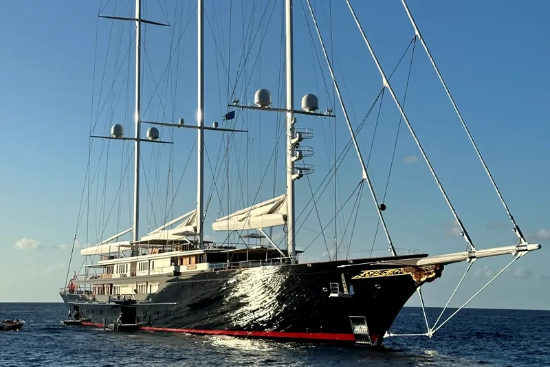 The black-hulled schooner Koru under its three masts