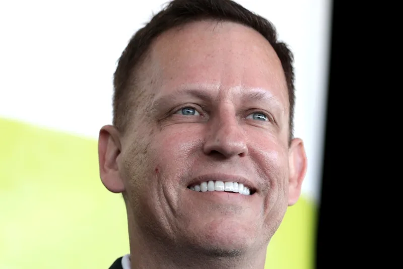 Peter Thiel, smiling, at a conference in 2022